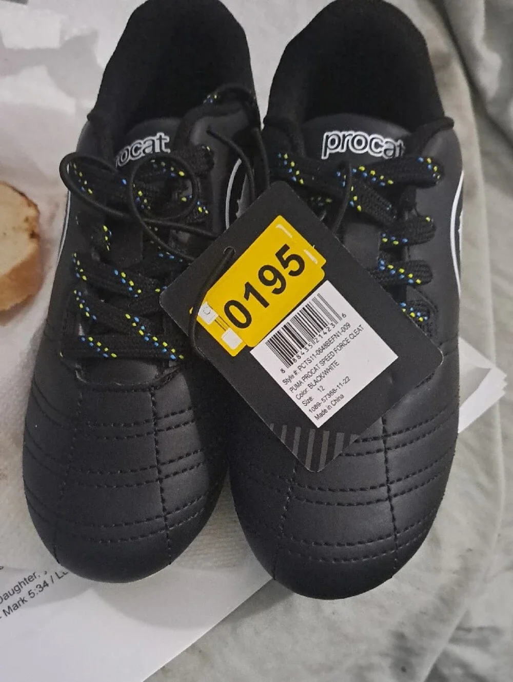 Puma Kids Black Soccer Cleats with Yellow Sole and Blue Studs